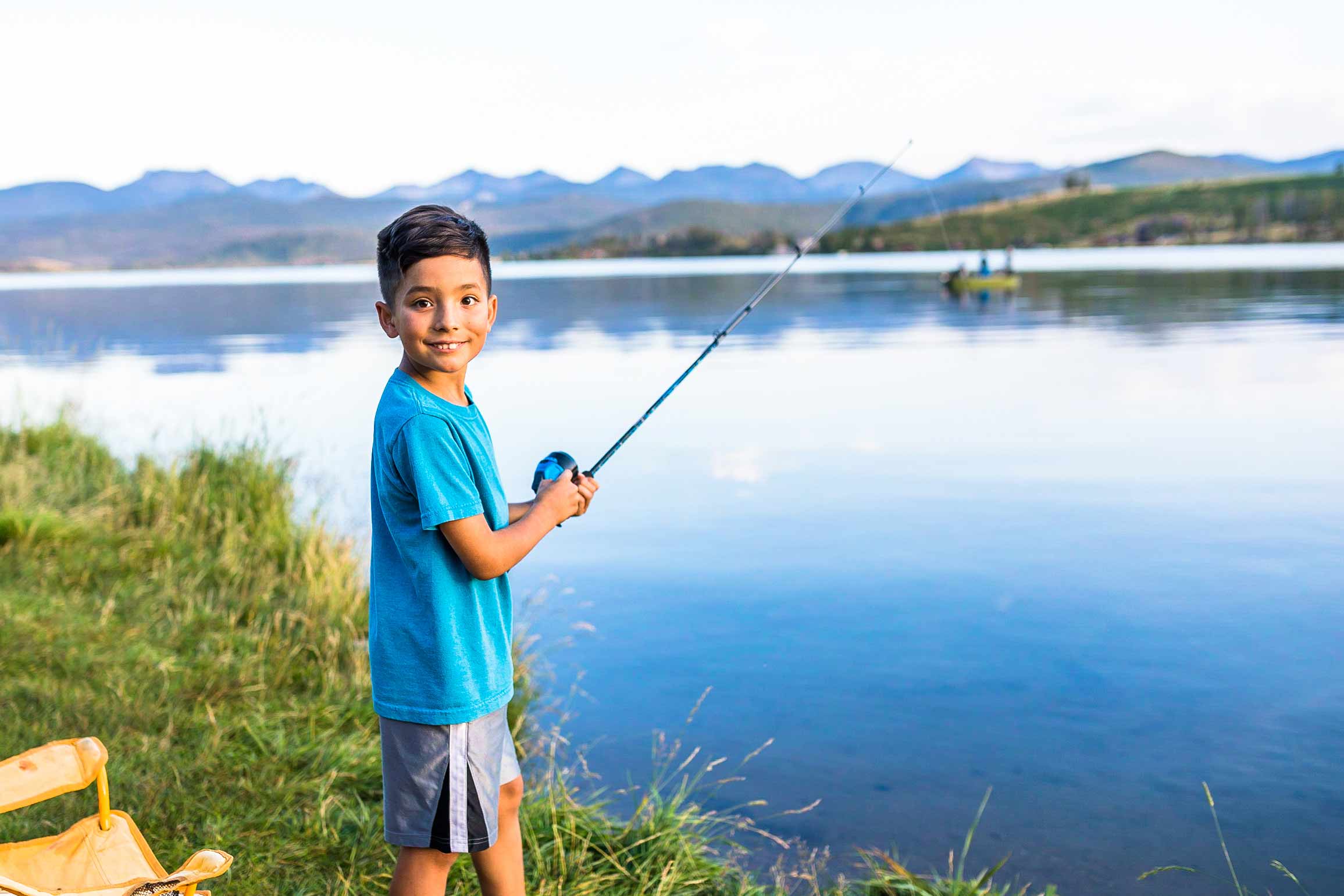 Young kid fishing Georgetown Lake near Philipsburg, Montana for trophy rainbow and brook trout.
